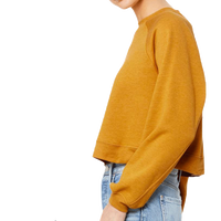 Bella + Canvas Women's Crop Raglan Fleece Crewneck Sweatshirt, Heather Mustard, Left Sleeve view