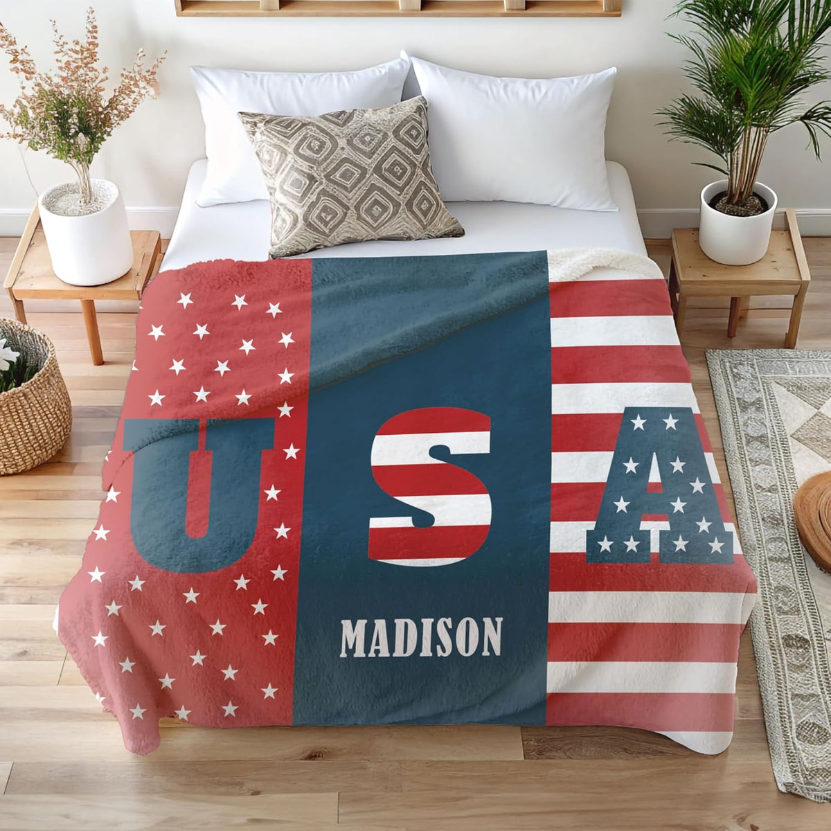 Personalized flag-themed name blanket on a bed